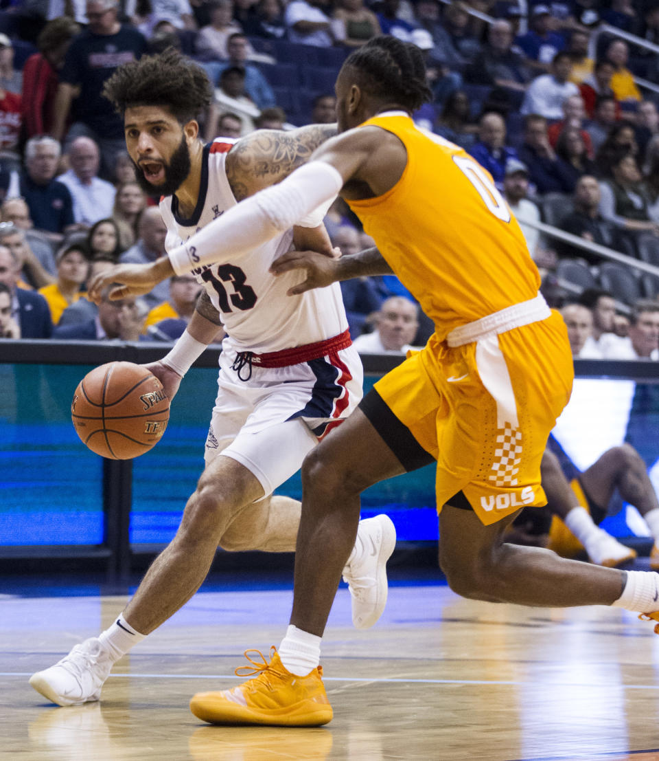 Gonzaga's Josh Perkins drives to the basket against Tennessee's Jordan Bone during the first half of an NCAA college basketball game Sunday, Dec. 9, 2018, in Phoenix. (AP Photo/Darryl Webb)