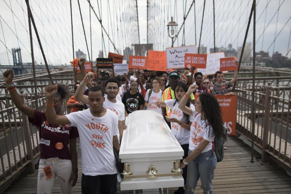 Gun control activists flock to Brooklyn Bridge to demand tougher regulations on weapons