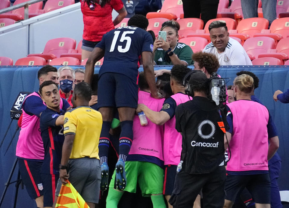 U.S. players celebrate a goal by Jordan Siebatcheu against Honduras during the second half of a CONCACAF Nations League soccer semifinal Thursday, June 3, 2021, in Denver. (AP Photo/Jack Dempsey)