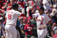 St. Louis Cardinals' Nolan Gorman (16) is congratulated by teammate Jordan Walker (18) after hitting a solo home run during the fifth inning of a baseball game against the Miami Marlins Sunday, April 7, 2024, in St. Louis. (AP Photo/Jeff Roberson)