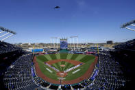 A B-2 Stealth Bomber flies over Kauffman Stadium before a baseball game between the Kansas City Royals and the Texas Rangers on Thursday, April 1, 2021, in Kansas City, Mo. (AP Photo/Charlie Riedel)