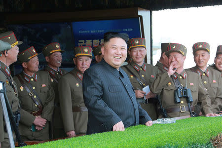 North Korea's leader Kim Jong Un watches a military drill marking the 85th anniversary of the establishment of the Korean People's Army (KPA) in this handout photo by North Korea's Korean Central News Agency (KCNA) made available on April 26, 2017. KCNA/Handout via REUTERS