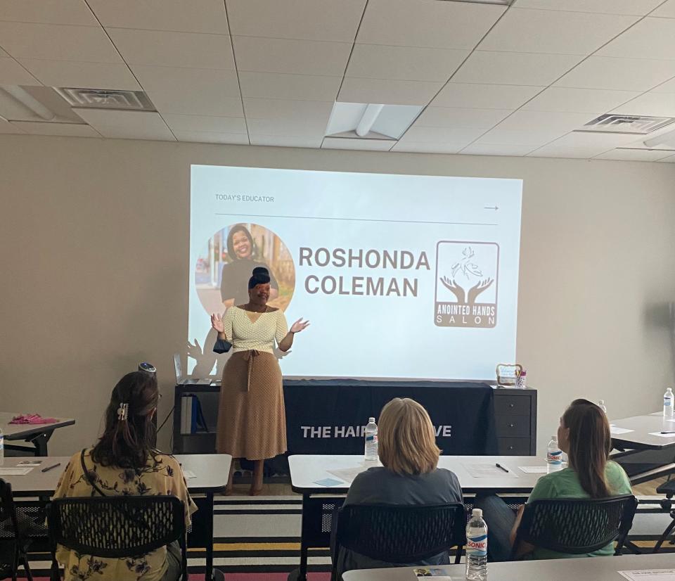 Stylist Rashonda Coleman leads an in-person workshop for The Hair Initiative. The nonprofit provides education and tools to caretakers of children with highly-textured hair.