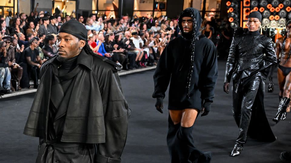 The rapper Offset made a surprise appearance on the runway to cheers from the crowd. - Gilbert Flores/WWD/Getty Images