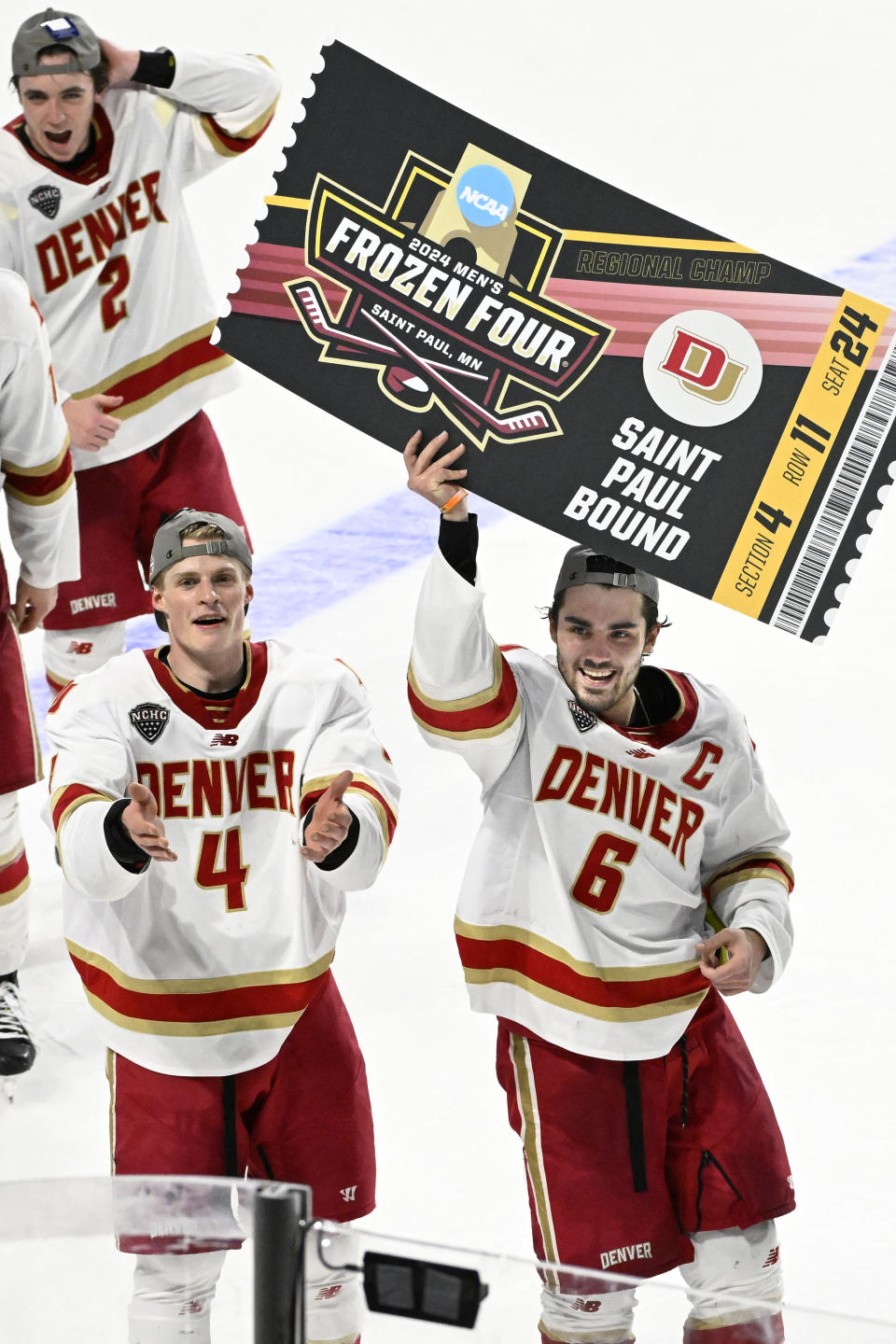 FILE - Denver forward McKade Webster (6) holds up a Frozen Four ticket while celebrating with Jack Devine (4) at the end of an NCAA men's college hockey tournament regional final against Cornell in Springfield, Mass., Saturday, March 30, 2024. Denver Pioneers forward McKade Webster will try to follow his younger sister’s lead after Makenna helped Ohio State win an NCAA hockey championship last month. McKade and the Pioneers face Boston University in a Frozen Four semifinal game, with the winner advancing to the title game. (AP Photo/Jessica Hill, File)