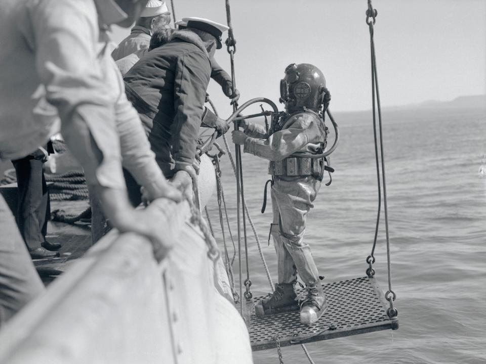 A US Navy School diver prepares for a dive in 1930.