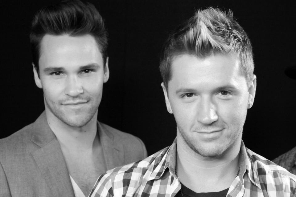 FILE - Nick Lazzarini, left, and Travis Wall pose for a photo in Los Angeles on Wednesday, Sept. 5, 2012. Televised dance shows brought fame to Lazzarini and Wall, who became big name attractions as Break The Floor instructors. Each of them has since been fired amid allegations of sexual misconduct. (AP Photo/Richard Vogel, File)