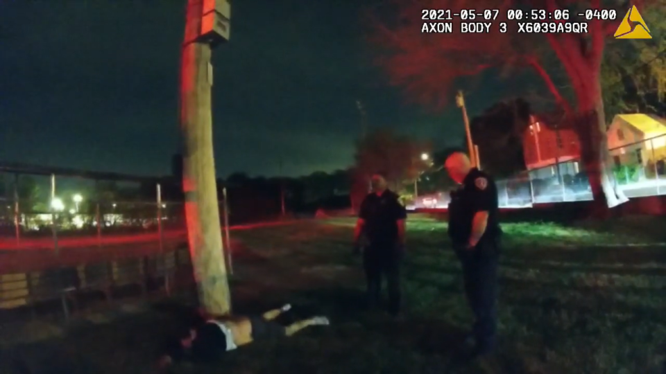 An image from Providence police body camera footage shows officers with Joseph Ventre, lying on the ground.