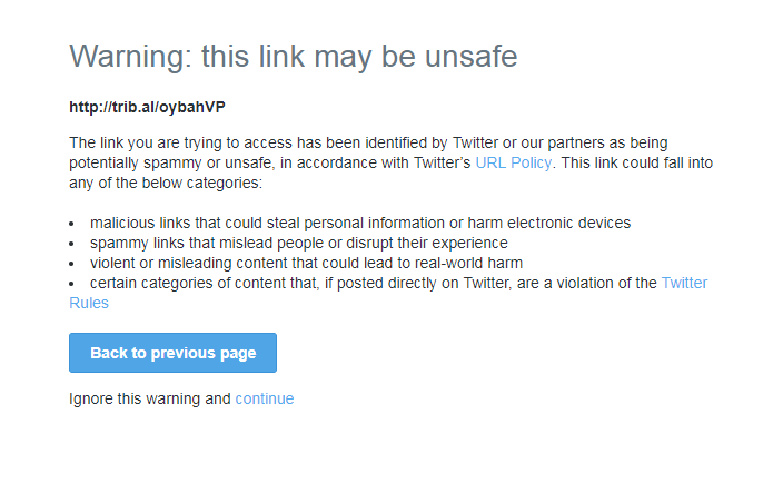 The message says: "Warning. This link may be unsafe." There is a blue button at the bottom to return to the previous page, and a much smaller, less colourful button to click through to the article - Telegraph/Twitter