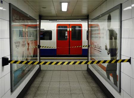 An empty tube train is seen at a cordoned off platform during rush hour at Oxford Circus underground station in London February 5, 2014. REUTERS/Luke MacGregor