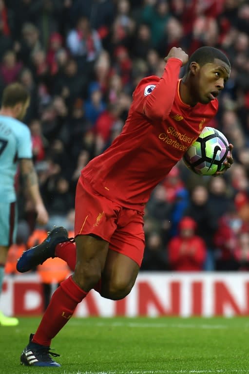 Liverpool's midfielder Georginio Wijnaldum celebrates after scoring their first goal during the English Premier League football match between Liverpool and Burnley at Anfield in Liverpool, north west England on March 12, 2017