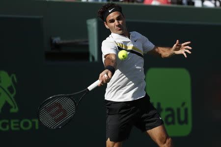 Mar 24, 2018; Key Biscayne, FL, USA; Roger Federer of Switzerland hits a forehand against Thanasi Kokkinakis of Australia (not pictured) on day five of the Miami Open at Tennis Center at Crandon Park. Mandatory Credit: Geoff Burke-USA TODAY Sports