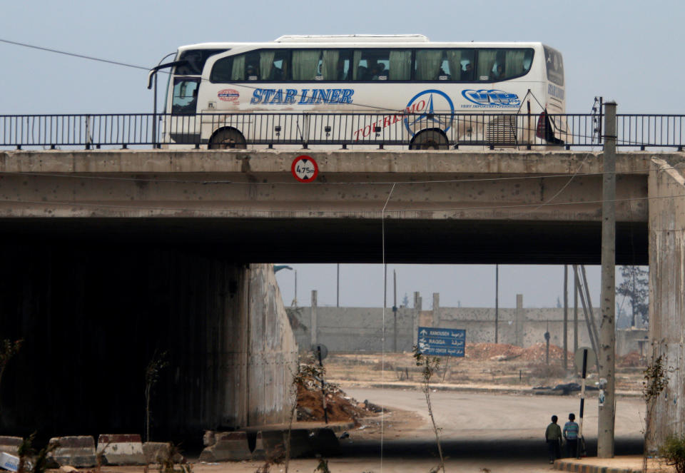 A bus bringing people out of eastern Aleppo drives back in the direction of the besieged rebel enclave, Syria December 16, 2016. REUTERS/Omar Sanadiki