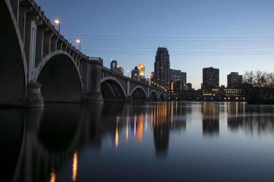 Building stand illuminated at dusk in downtown Minneapolis, Minnesota, U.S., on Saturday, April 18, 2020. Governor Tim Walz of Minnesota, a state that President Donald Trump tweeted should “liberate,” said he agrees with the president’s desire to reopen business but won’t endanger residents by acting recklessly. Photographer: Ariana Lindquist/Bloomberg via Getty Images