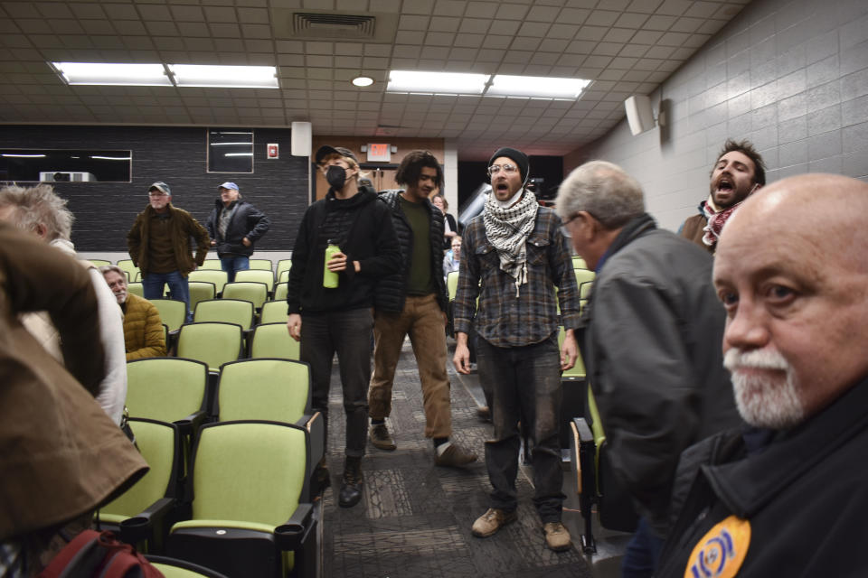 Activists call for a ceasefire in Gaza during a town hall hosted by U.S. Sen. Jon Tester at Montana Technological University, Nov. 10, 2023, in Butte, Mont. Tester is seeking re-election to a fourth term. (AP Photo/Matthew Brown)