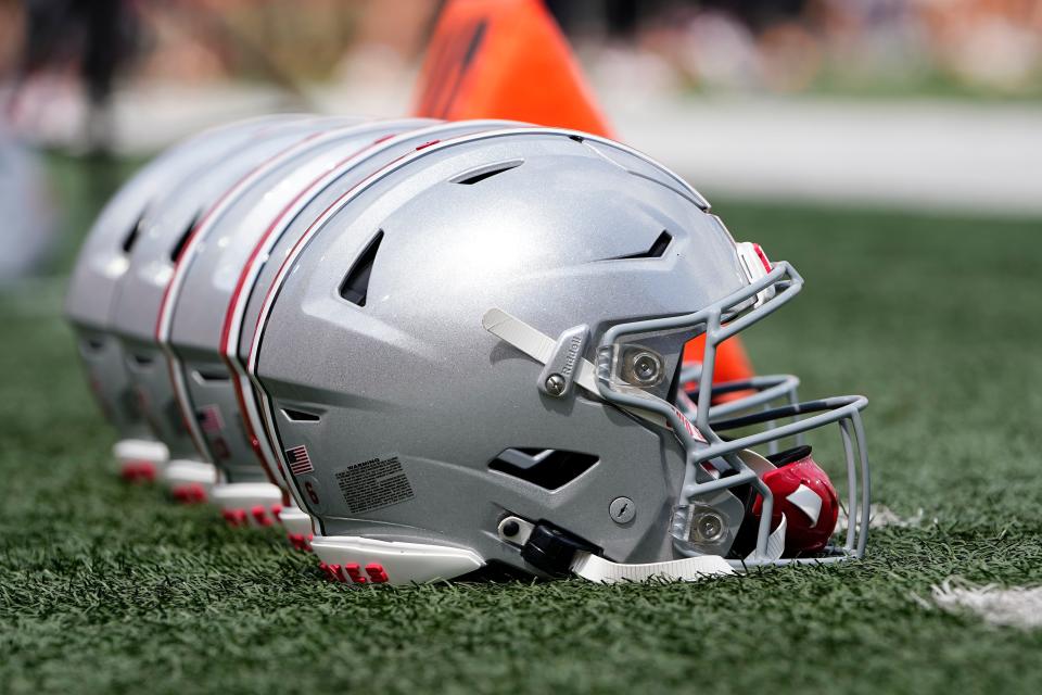 Sep 2, 2023; Bloomington, Indiana, USA; Ohio State Buckeyes helmets sit on the sideline prior to the NCAA football game at Indiana University Memorial Stadium. Ohio State won 23-3.