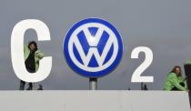 File photo of Greenpeace activists demonstrating as they stand on top of Volkswagen's "Sandkamp" gate in Wolfsburg, Germany, November 9 , 2015. REUTERS/Fabian Bimmer/Files