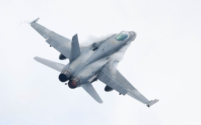 The Royal Australian Air Force’s F-18 Classic Hornet appears in the sky on Oct. 5, 2017, in Townsville, Australia. Canada currently operates the Classic Hornet aircraft, which was originally rolled out in the 1980s. Photo from Getty Images.