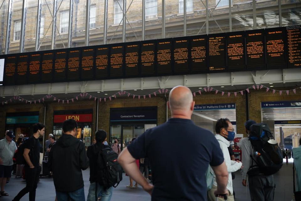 Departure boards at King’s Cross station in London (Yui Mok/PA) (PA Wire)