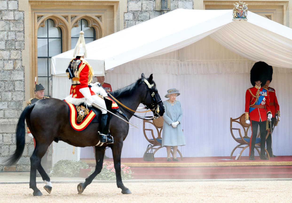 WINDSOR, UNITED KINGDOM - JUNE 12: (EMBARGOED FOR PUBLICATION IN UK NEWSPAPERS UNTIL 24 HOURS AFTER CREATE DATE AND TIME) Queen Elizabeth II accompanied by Prince Edward, Duke of Kent (in his role as Colonel of the Scots Guards) attends a military parade, held by the Household Division (during which The Queen's Colour of F Company Scots Guards will be trooped) in the Quadrangle of Windsor Castle, to mark her Official Birthday on June 12, 2021 in Windsor, England. For the second consecutive year The Queen's Birthday Parade, known as Trooping the Colour, hasn't been able to go ahead in it's traditional form at Buckingham Palace and Horse Guards Parade due to the ongoing COVID-19 Pandemic. (Photo by Max Mumby/Indigo - Pool/Getty Images)