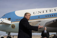 President Donald Trump speaks with reporters as he boards Air Force One as he departs Tuesday, Feb. 18, 2020, at Andrews Air Force Base, Md.(AP Photo/Alex Brandon)