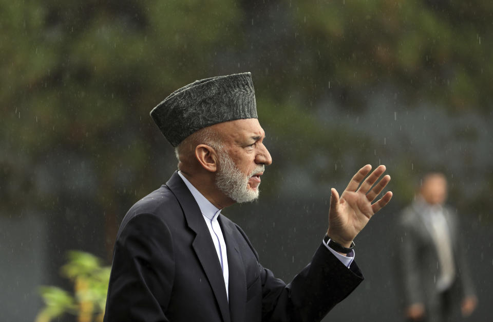 Afghanistan's former President Hamid Karzai speaks during a news conference in Kabul, Afghanistan, Tuesday, July 13, 2021. Former President Karzai calls on both the Afghan government and the Taliban to resume negotiations and end fighting in the country. (AP Photo/Rahmat Gul)