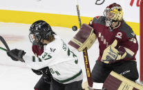 Montreal goaltender Ann-Renee Desbiens (35) keeps her eyes on the puck as Boston's Theresa Schafzahl (37) looks for the rebound during the third period of Game 1 of a PWHL hockey playoff series Thursday, May 9, 2024, in Montreal. (Christinne Muschi/The Canadian Press via AP)