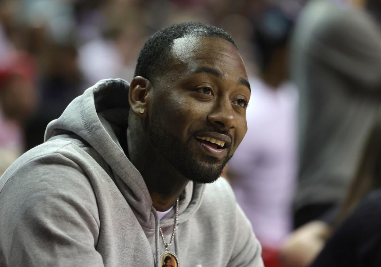 John Wall watches a summer league game in Las Vegas.