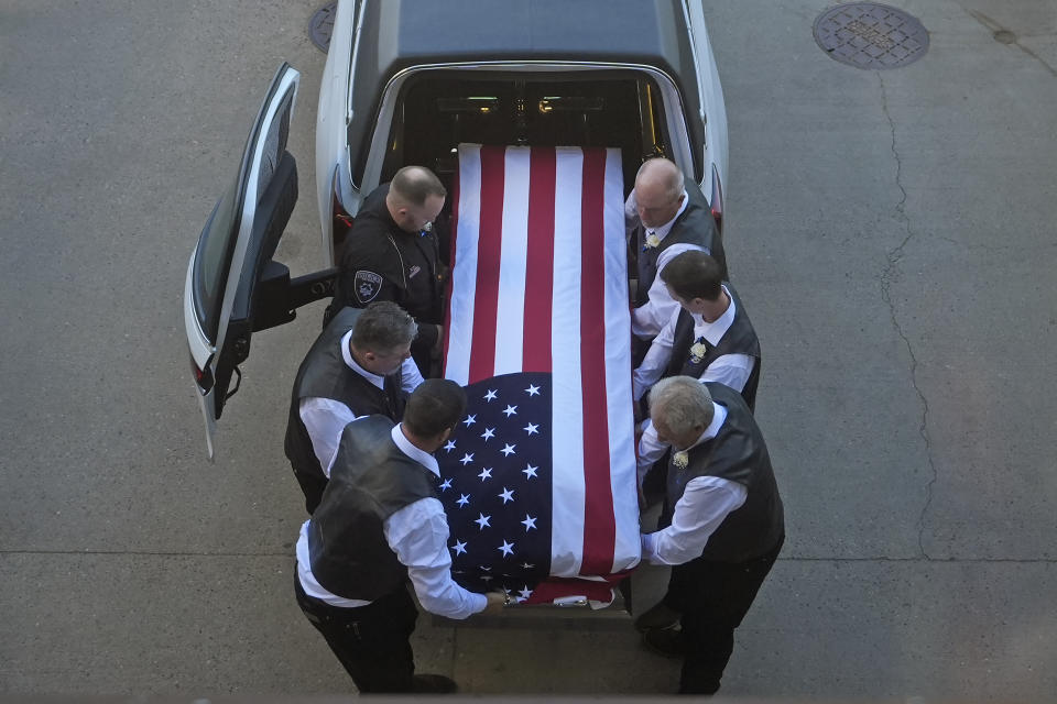 The casket of Santaquin Police Sgt. Bill Hooser arrives at Utah Valley University Monday, May 13, 2024, in Orem, Utah. Hooser was killed on May 5, 2024, while helping a Utah Highway Patrol trooper with a traffic stop when police say a man driving a semi-trailer intentionally hit Hooser. (AP Photo/Rick Bowmer)