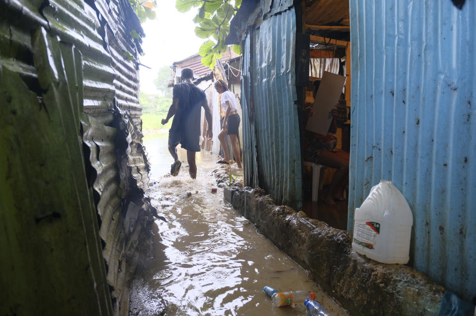 Dominican officials inspect damage inflicted by Tropical Storm Franklin