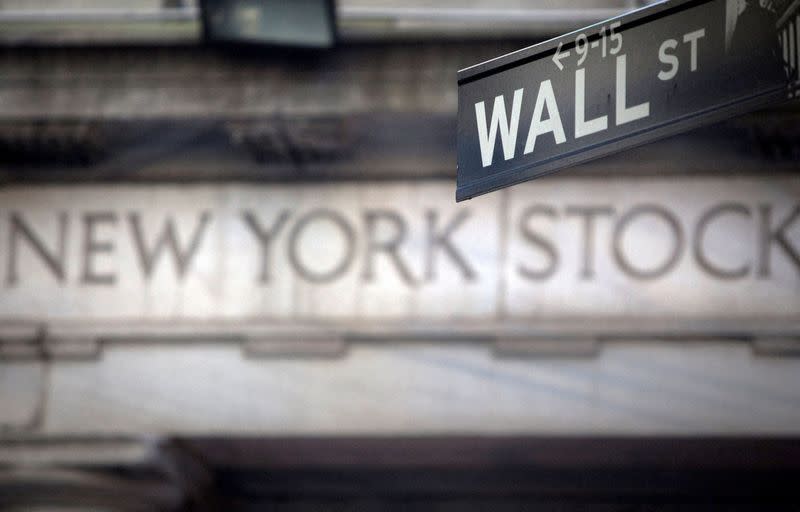 FILE PHOTO: A Wall Street sign outside the New York Stock Exchange