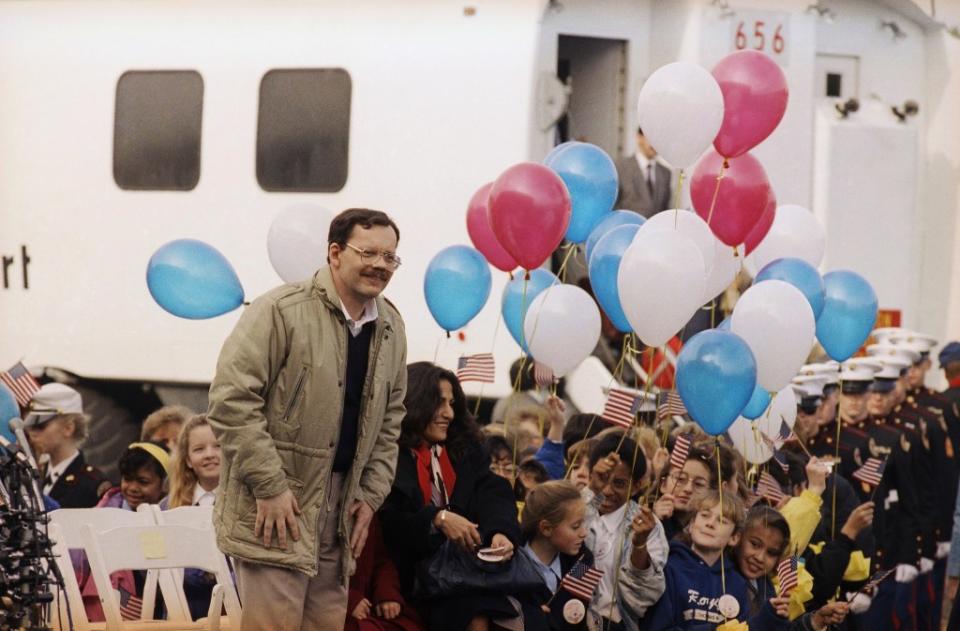 Anderson arriving at Dulles International Airport in Virginia after being released on Dec. 12, 1991. AP Photo/Barry Thumma, File