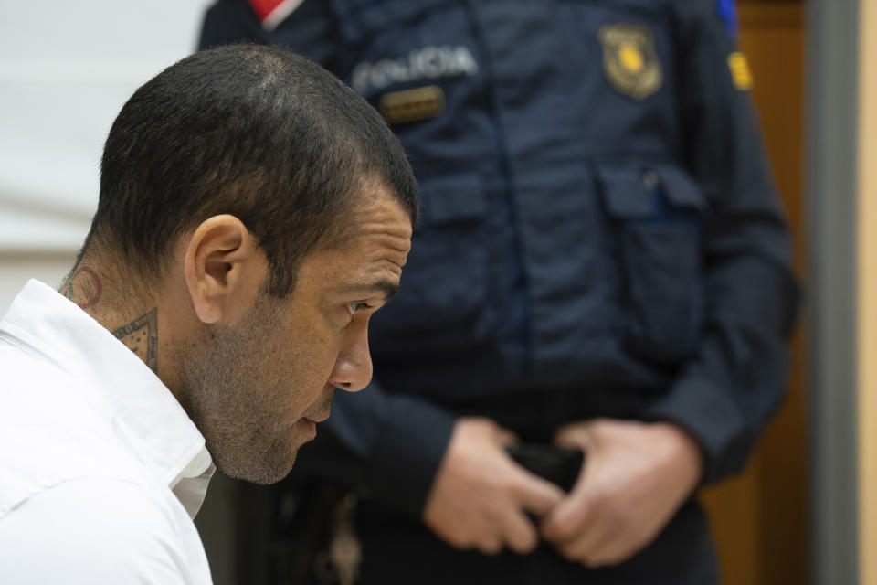 Brazilian soccer star Dani Alves sits during his trial in Barcelona, Spain, Monday, Feb. 5, 2024. Dani Alves goes on trial Monday a year after he allegedly sexually assaulted a young woman at a Barcelona nightclub. The 40-year-old Alves is accused of sexually assaulting the woman on the night of Dec. 30, 2022. He denies any wrongdoing. (D.Zorrakino/Pool Photo via AP)