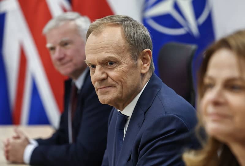 Polish Prime Minister Donald Tusk attends trilateral talks with NATO Secretary General Jens Stoltenberg and UK Prime Minister Rishi Sunak at the Warsaw Armoured Brigade. Henry Nicholls/PA Wire/dpa