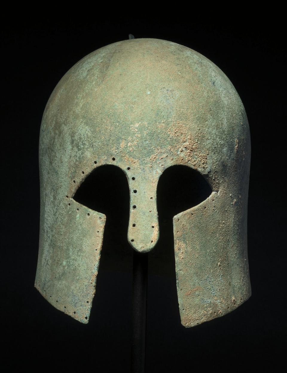 Lot 272: A Greek bronze helmet of Corinthian type, early 6th century B.C. Estimate: $50,000 - 70,000.