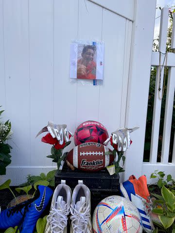<p>Claudia Stinson</p> A memorial for Anthony Stinson outside his family's home in Long Island. A football and soccer ball symbolized his two favorite sports.