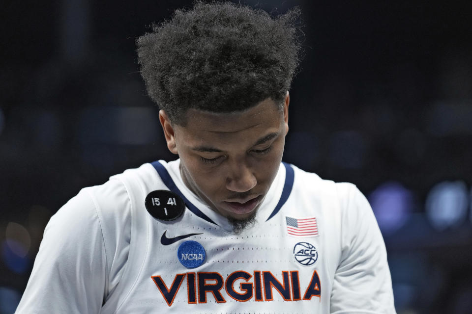 Virginia guard Reece Beekman reacts as he leaves the court after the team lost to Furman in a first-round college basketball game in the NCAA Tournament Thursday, March 16, 2023, in Orlando, Fla. (AP Photo/Chris O'Meara)