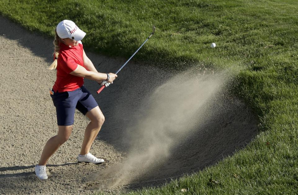 Charley Hull, of England, hits from a bunker on the 16th hole during the third round of the Kraft Nabisco Championship golf tournament on Saturday, April 5, 2014, in Rancho Mirage, Calif. (AP Photo/Chris Carlson)