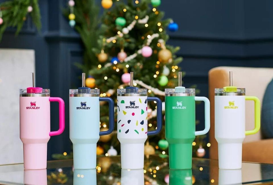 The tumbler in five bright colors, including pink, green, blue, and confetti