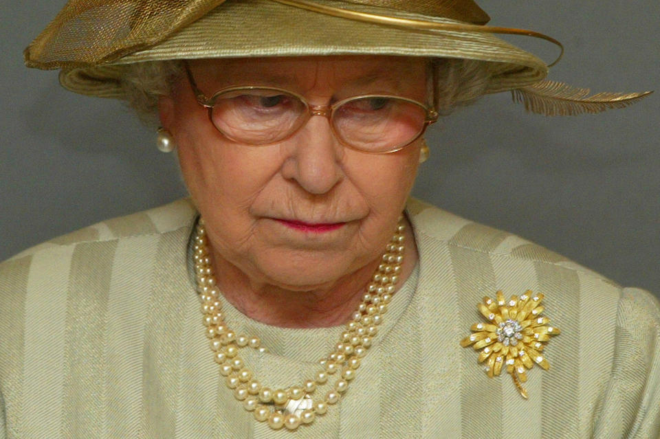 <p>The Queen looks down during her official address at the opening of the Churchill Museum at The Cabinet War Rooms in London on 10 February 2005. (Reuters)</p> 
