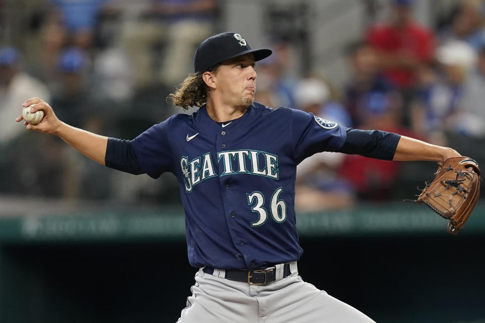 Seattle Mariners starting pitcher Logan Gilbert throws during the first inning of a baseball game against the Texas Rangers in Arlington, Texas, Sunday, Aug. 14, 2022. (AP Photo/LM Otero)