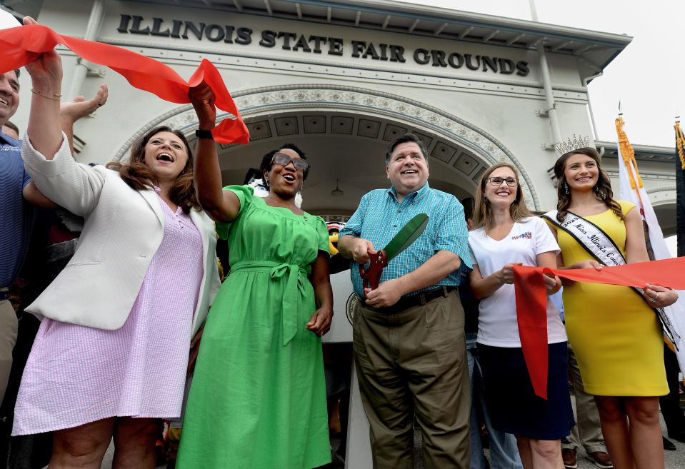 Illinois Gov. JB Pritzker, center, cut the ribbon to officially start off this years Illinois State Fair Thursday, August 10, 2023. Joining Pritzker was Springfield Mayor Misty Buscher, left, Lt. Gov. Juliana Stratton, center left, Director of the Illinois State Fair Rebecca Clark, center right, and Miss Illinois County Fair Queen 2023 Paige Van Dyke.