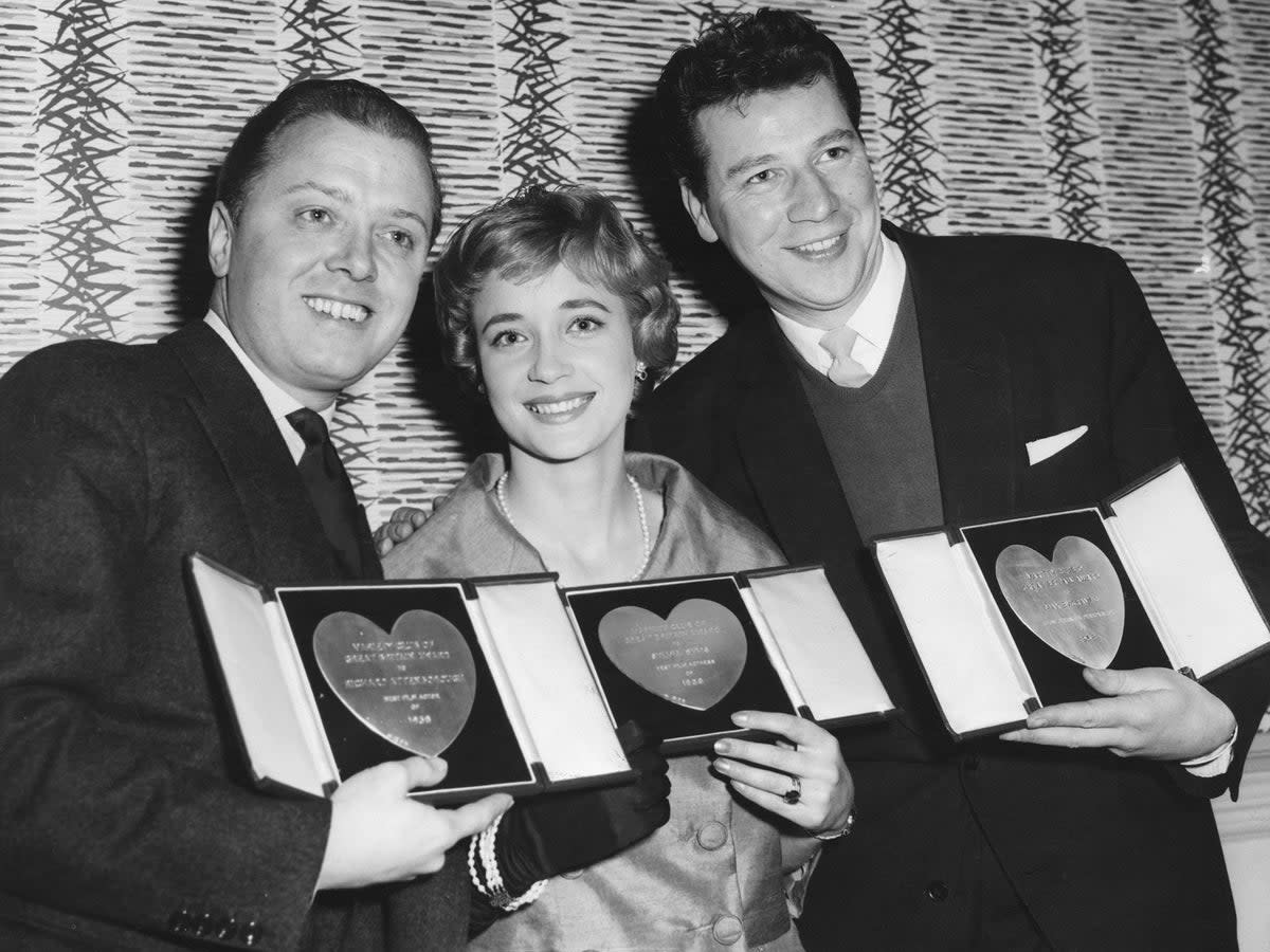 From left to right, actors Richard Attenborough, Sylvia Syms and Max Bygraves with their awards at the Variety Club Luncheon in March 1959 (Getty)