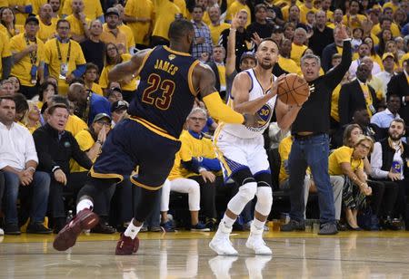 Jun 1, 2017; Oakland, CA, USA; Golden State Warriors guard Stephen Curry (30) shoots against Cleveland Cavaliers forward LeBron James (23) in the second half of the 2017 NBA Finals at Oracle Arena. Mandatory Credit: Kyle Terada-USA TODAY Sports