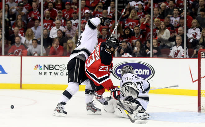  David Clarkson #23 Of The New Jersey Devils Collides With Jonathan Quick #32 And Jarret Stoll #28 Of The Los Angeles  Getty Images