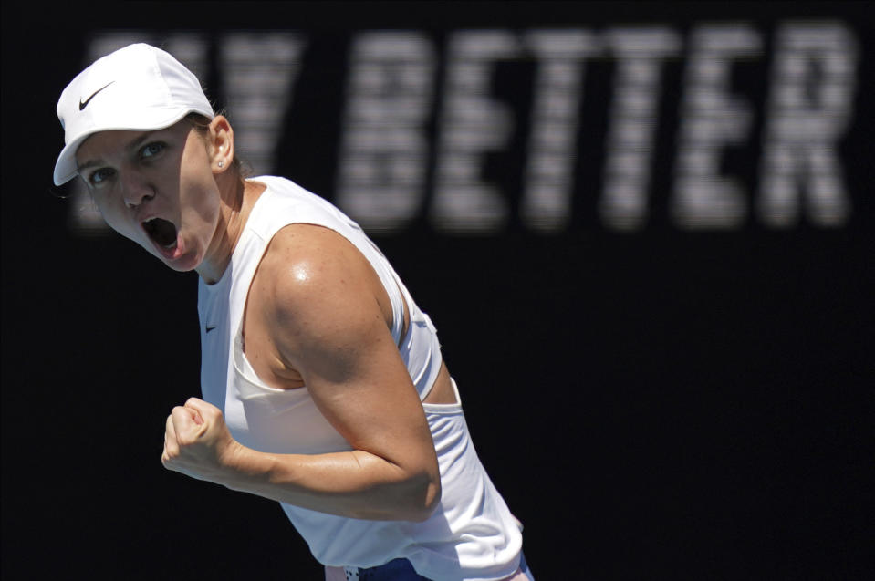 Romania's Simona Halep reacts after winning a point against Estonia's Anett Kontaveit during their quarterfinal match at the Australian Open tennis championship in Melbourne, Australia, Wednesday, Jan. 29, 2020. (AP Photo/Lee Jin-man)