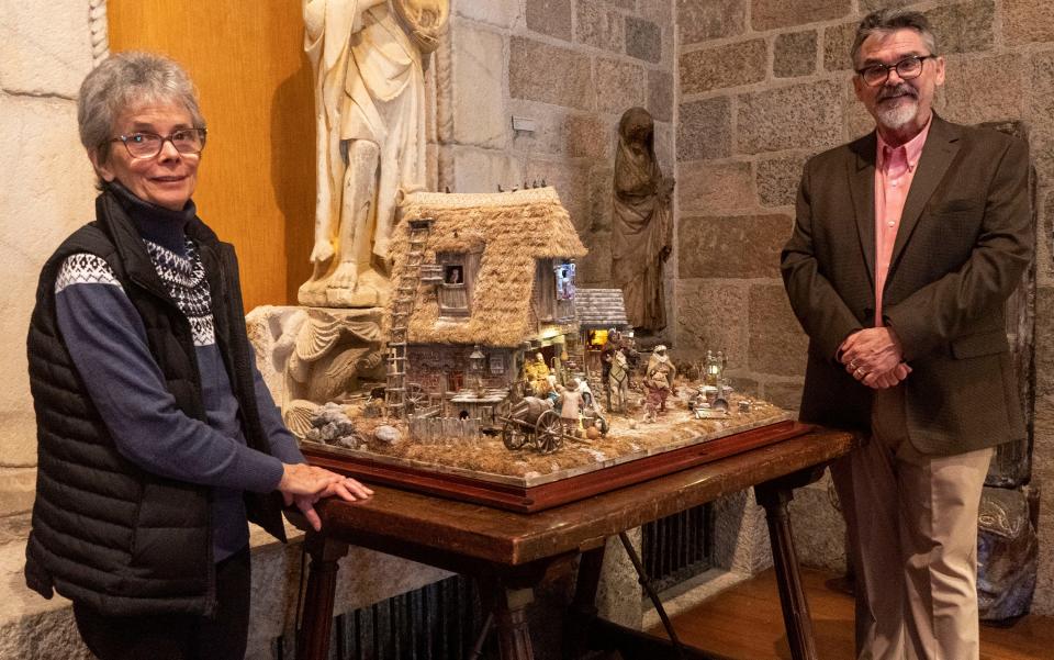 Karen Loccesano, left, and Michael Palan, right, next to their Nativity scene on display at The World Nativities inside the Glencairn Museum in Bryn Athyn on Wednesday, Nov. 29, 2023.

[Daniella Heminghaus | Bucks County Courier Times]