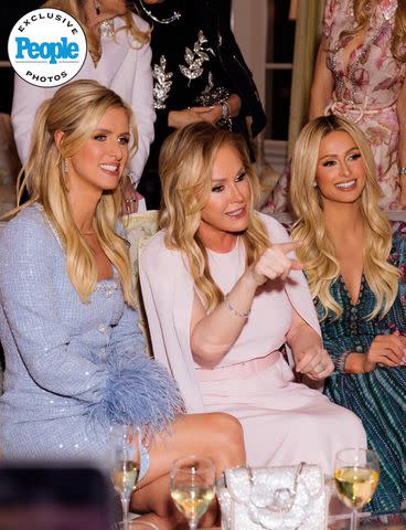 <p>Kevin Ostajewski</p> From left: Nicky, Kathy and Paris Hilton mingle with guests