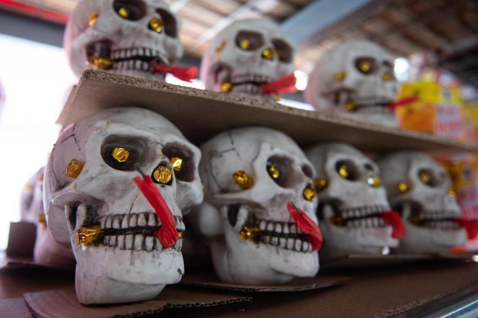 Rows of fireworks in the shape of skulls grin at customers at the fireworks tent at the River Roll Skate Center in Riverside, Missouri.