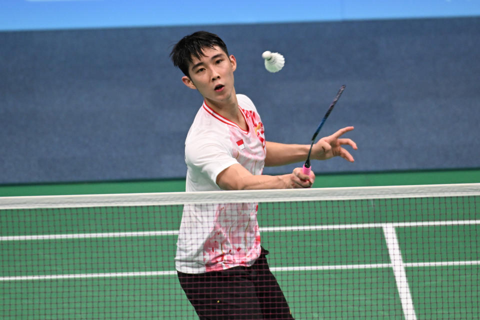 Singapore shuttler Loh Kean Yew in action against Malaysia's Ng Tze Yong in the men's singles competition of the 2023 Hangzhou Asian Games. (PHOTO: Sport Singapore/Lim Weixiang)